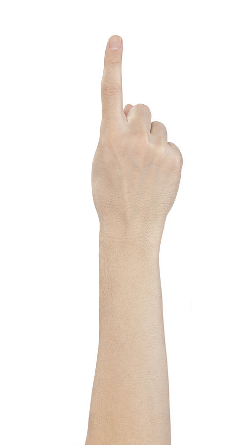 Hand showing one finger on white background Photograph by Atiatiati