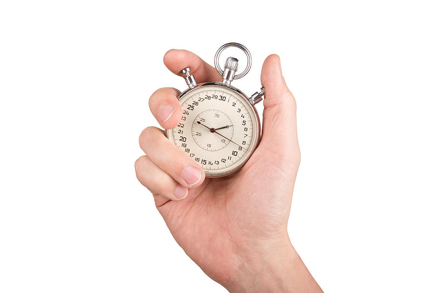 Hand with a stopwatch. Isolated on white background. Photograph by Yevgen Romanenko