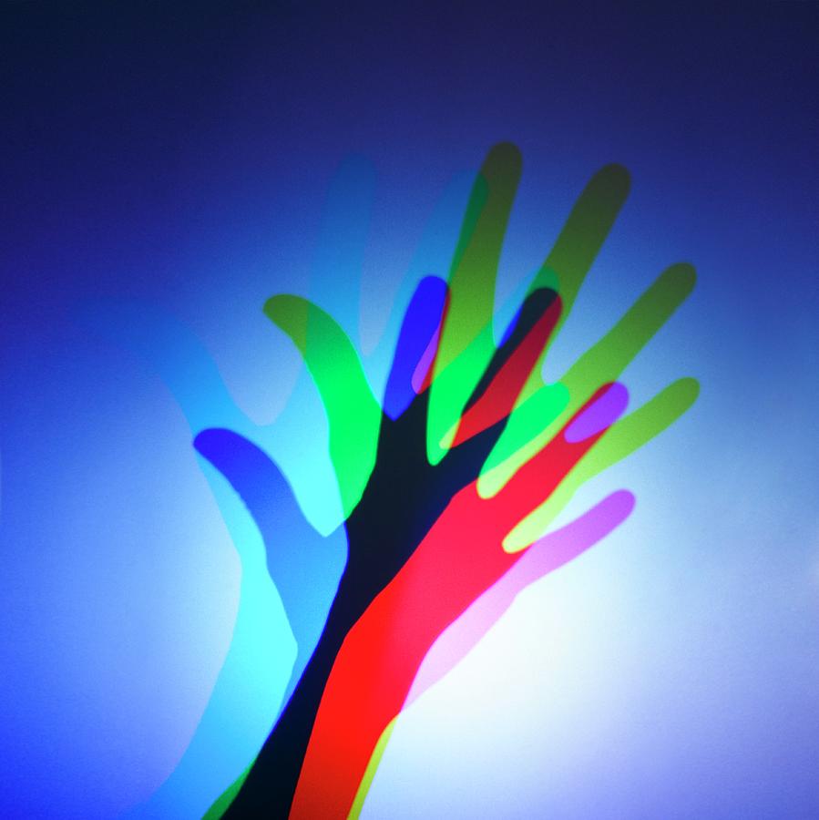 Hand With Colour Mixing Photograph by Science Photo Library