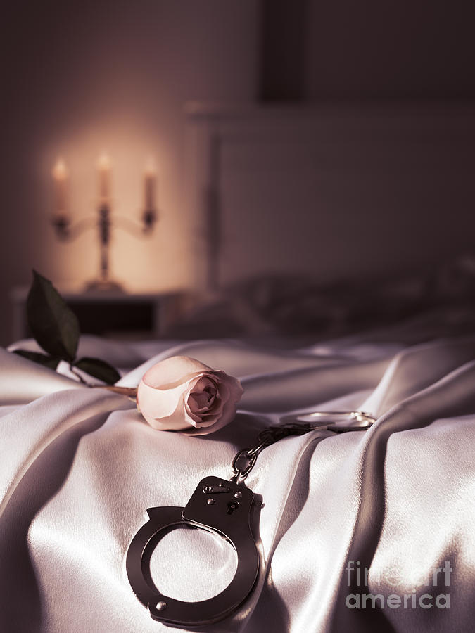 Still Life Photograph - Handcuffs and a rose on bed by Maxim Images Exquisite Prints