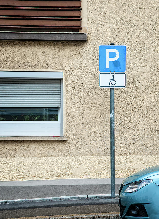 Handicapped Parking Sign And Car Photograph by Thomas Winz