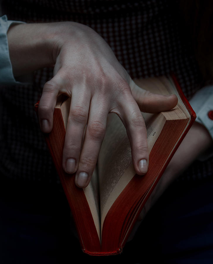 Hands holding a book whick looks like vagina, sex education Photograph by Nina Sinitskaya