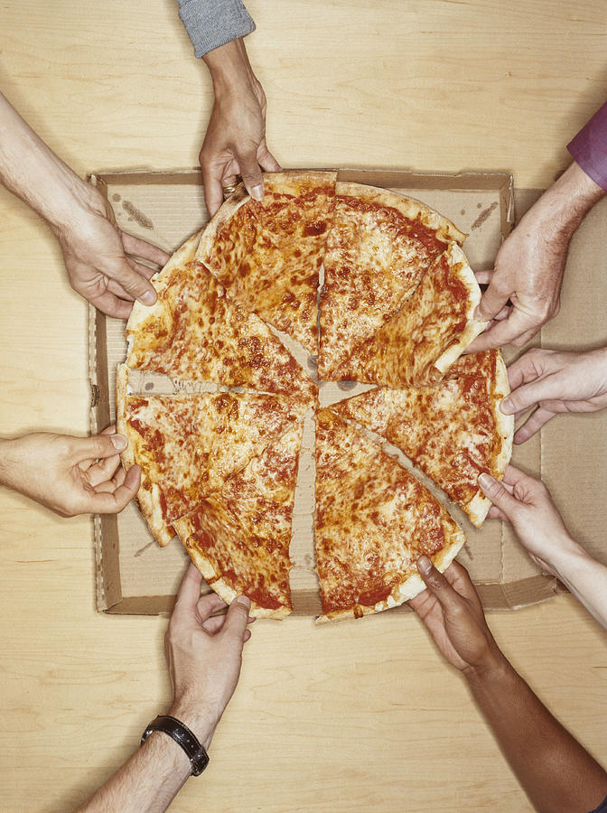 Hands Holding Pizza Slices Photograph by Emmanuel Faure