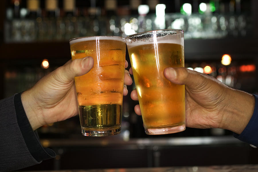 Hands of men toasting with beer Photograph by Thinkstock