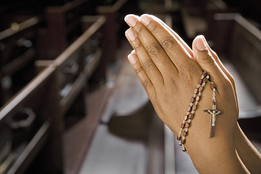 Hands Praying in Church With Rosary Photograph by Paul Burns