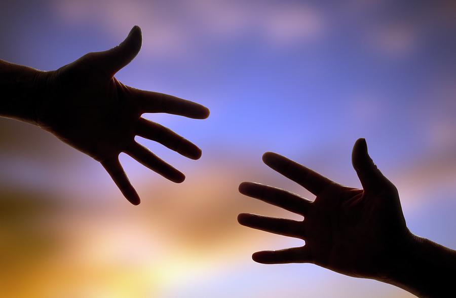 Hands Reaching Towards Each Other Photograph By Victor De Schwanberg