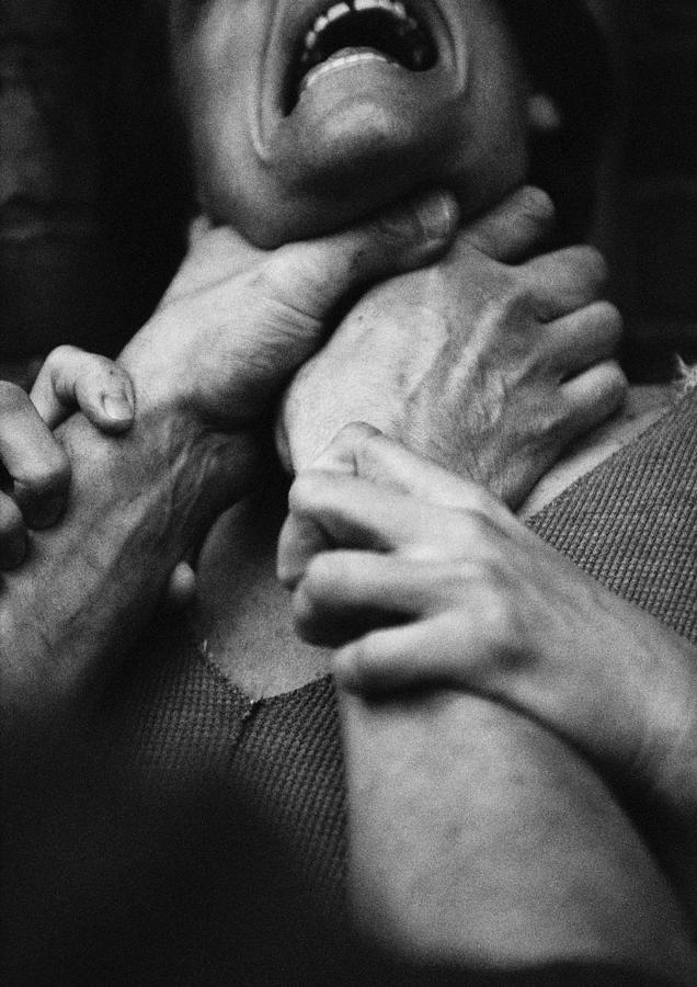 Hands strangling woman, close-up, b&w Photograph by Laurent Hamels