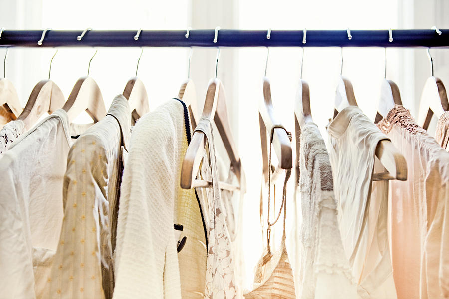 Hangers with clothes Photograph by Orbon Alija
