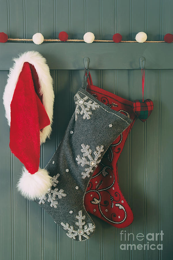 Hanging stockings and Santa hat on hook Photograph by Sandra Cunningham