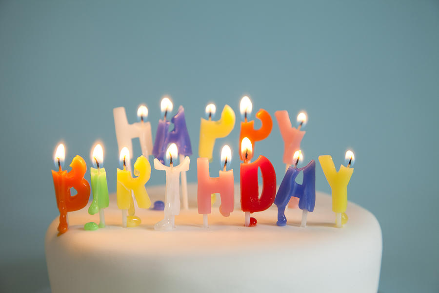 Happy Birthday candles on a birthday cake Photograph by JamieB
