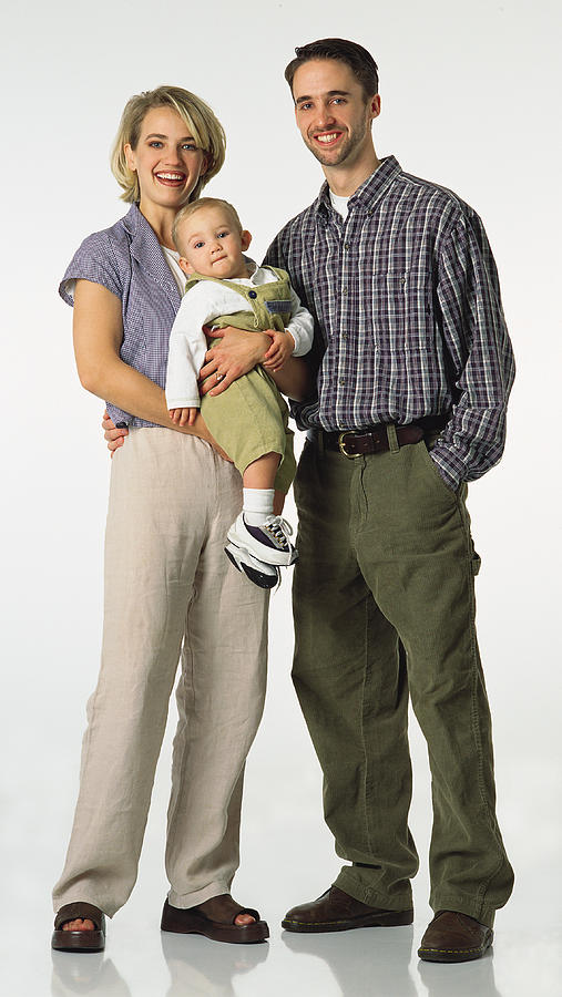 Happy Caucasian Preppy Couple And Their Baby Stand Together Photograph by Photodisc