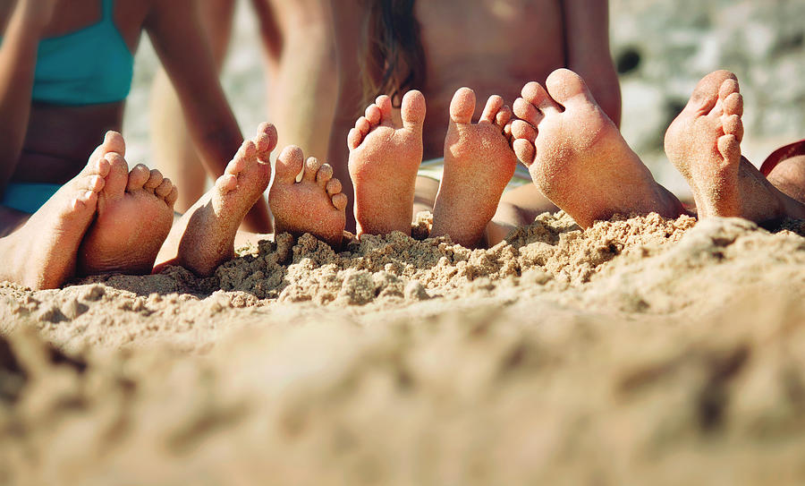 Happy feet. Barefoot family on the sand Photograph by Sol de Zuasnabar Brebbia