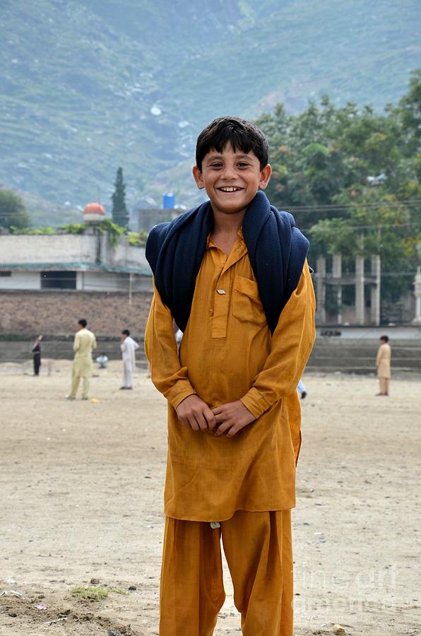 Happy laughing Pathan boy in Swat Valley Pakistan Photograph by Imran Ahmed