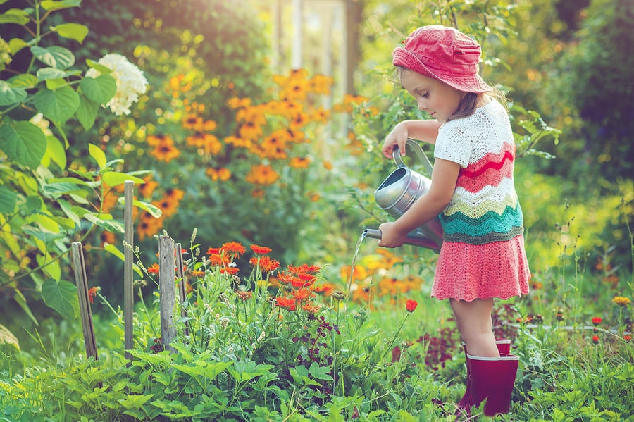 Happy little girl in garden Photograph by ArtMarie