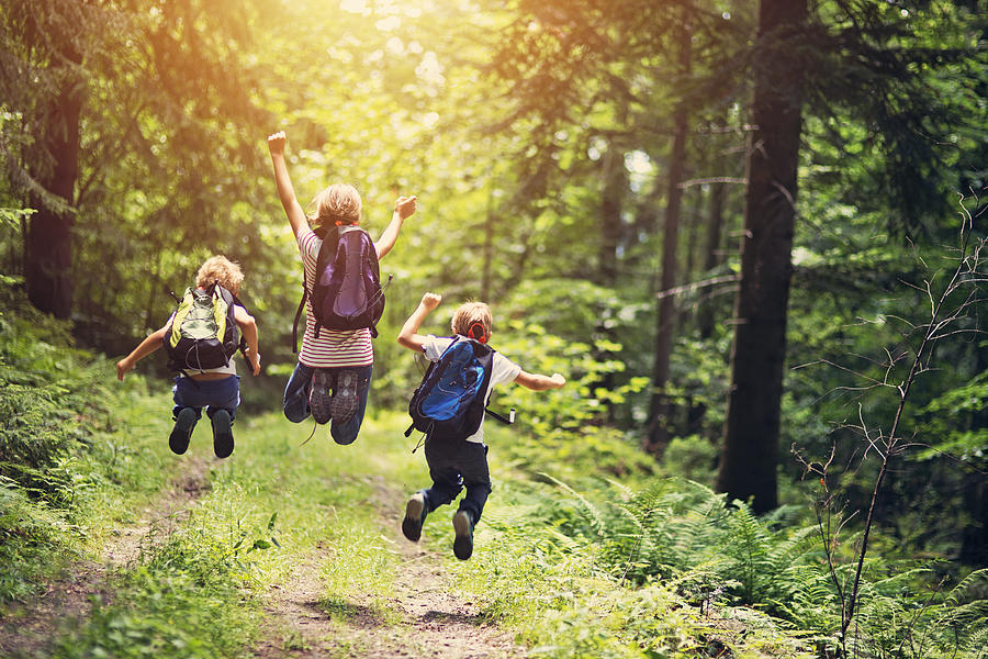 Happy little hikers jumping with joy Photograph by Imgorthand