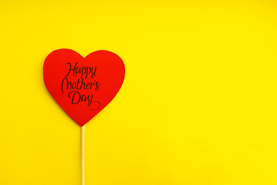Happy Mothers Day. Red paper heart on yellow background Photograph by Emilija Manevska