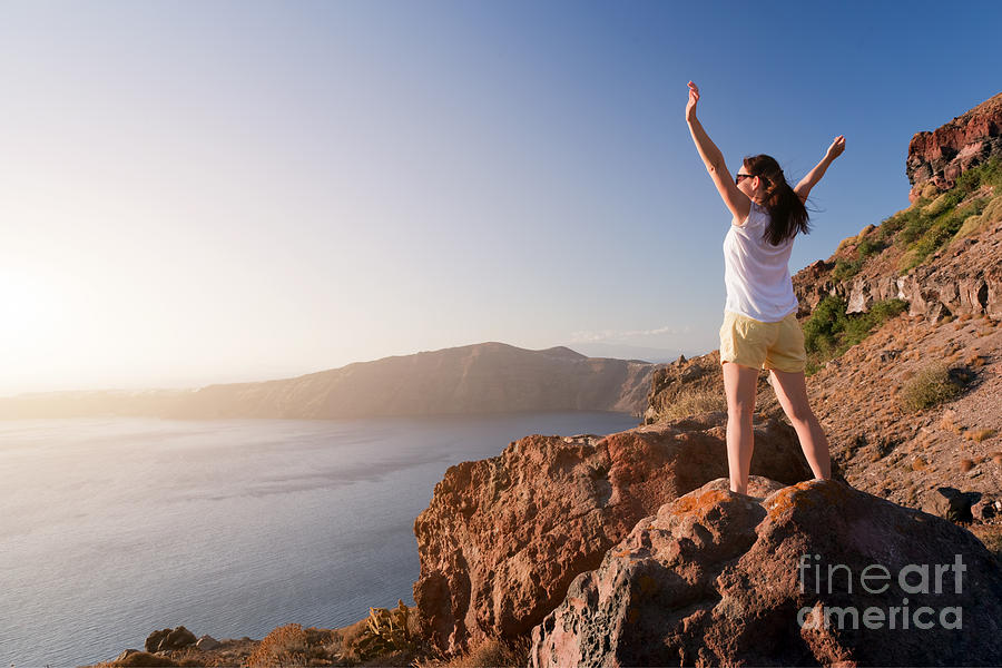 Happy woman on the rock with hands up Photograph by Michal Bednarek