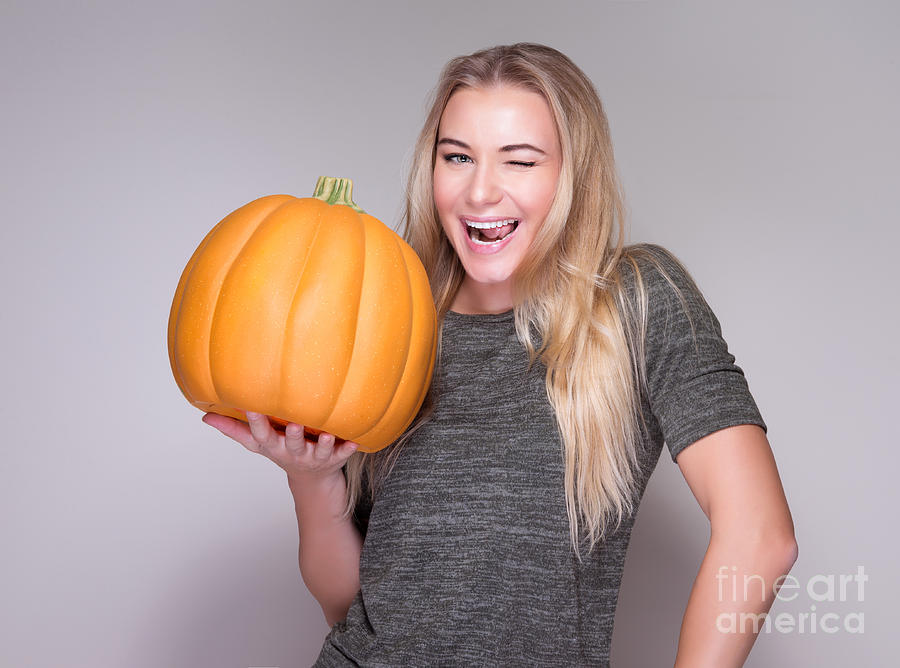 Happy woman with pumpkin Photograph by Anna Om