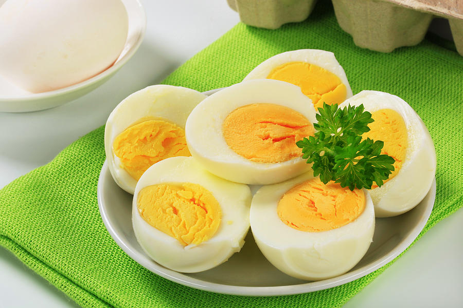 Hardboiled eggs on a plate Photograph by Milanfoto
