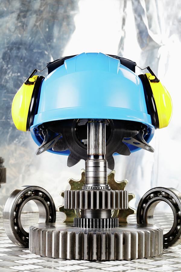 Hardhat With Industrial Gears Photograph by Christian Lagerek/science Photo Library