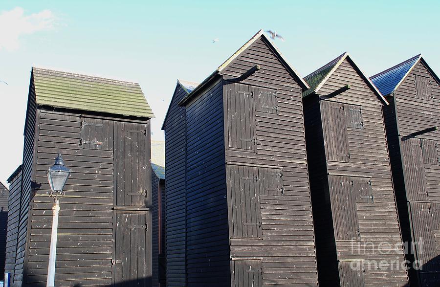Hastings net huts Photograph by David Fowler