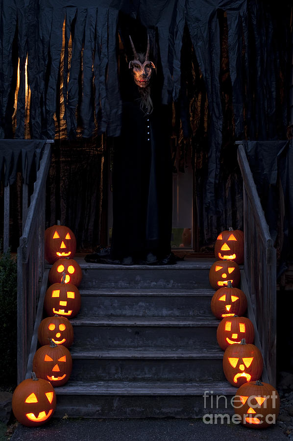 Haunted House with Lit pumpkins and Demon Photograph by Jim Corwin