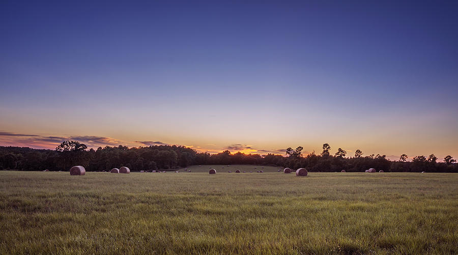 Hay Bales In A Field At Sunset Photograph