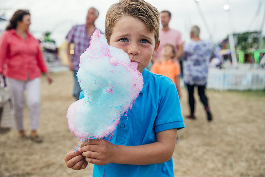 He Loves Eating Cotton Candy Photograph by SolStock
