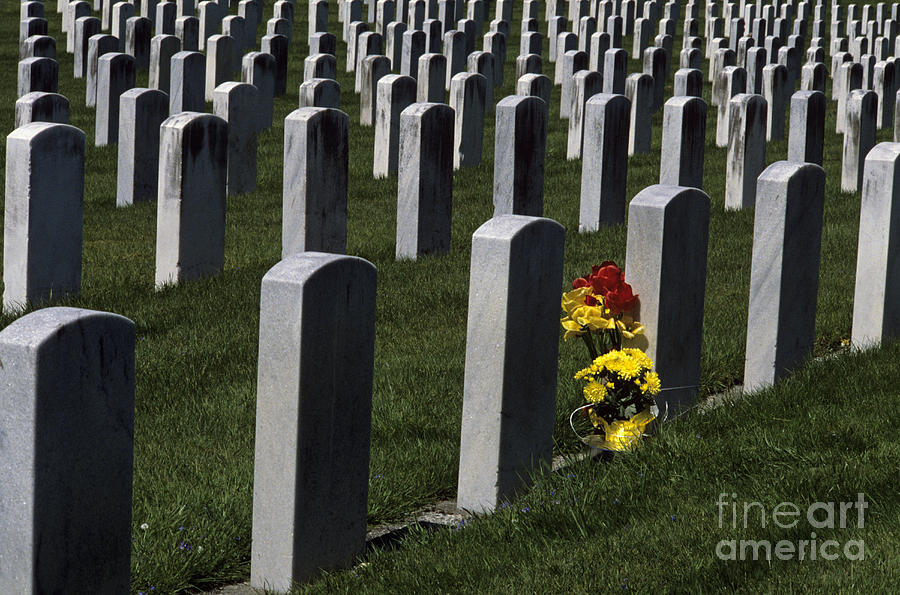Head Stones at Cemetery with Flowers Photograph by Jim Corwin