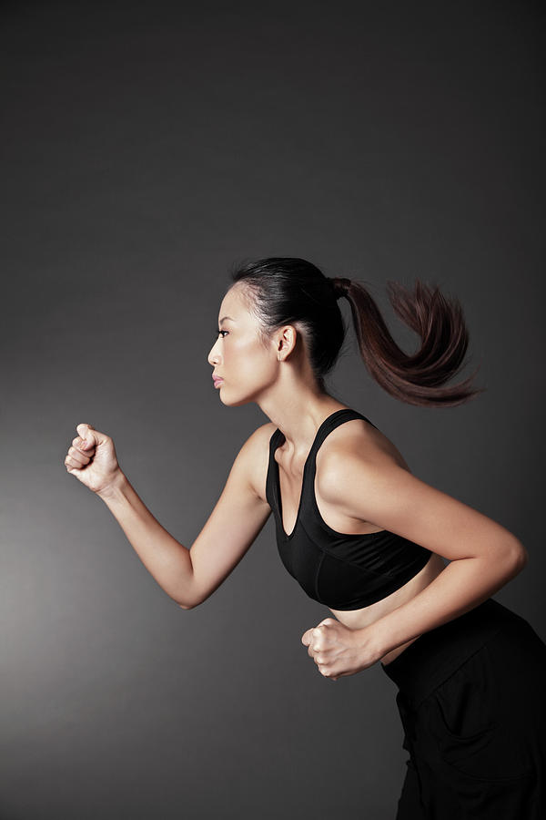Healthy Asian Woman Running Photograph by Harvey Tsoi
