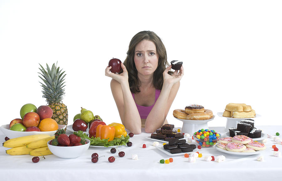 Healthy food vs. junk food Photograph by Matthew Dickstein