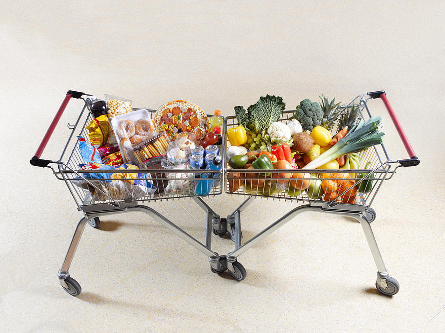 Healthy vs unhealthy shopping trolleys Photograph by Peter Dazeley