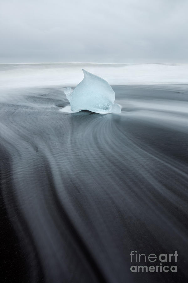 Heart shaped iceberg on black sand beach Iceland Photograph by Matteo Colombo