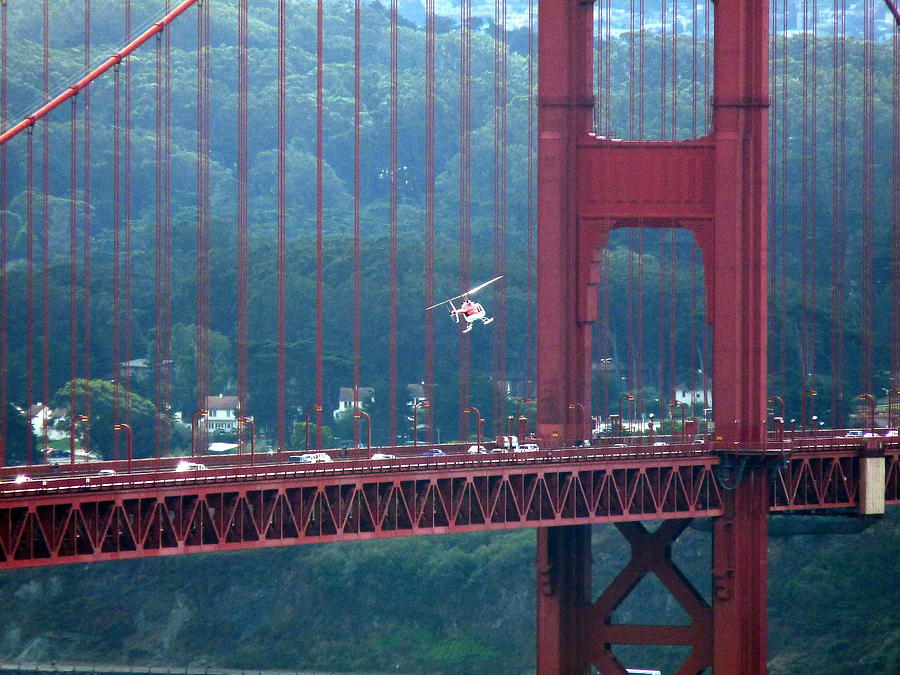 Helicopter in Golden Gate Bridge Photograph by Jeff Lowe