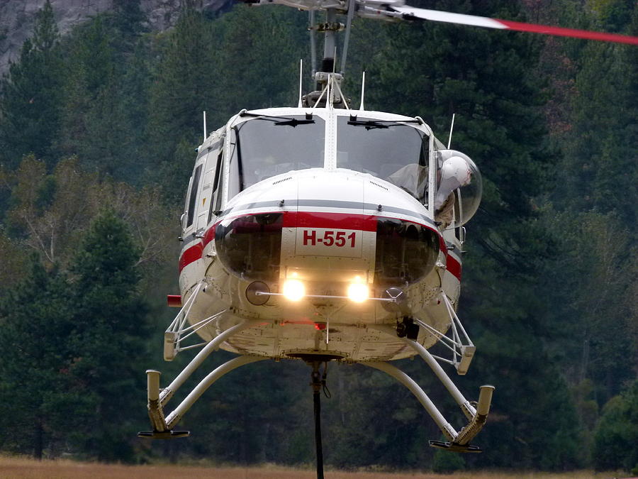 Helicopter Lifting Off Photograph by Jeff Lowe