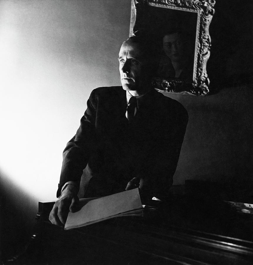 Henry Barraud Holding Paper Photograph by Horst P. Horst