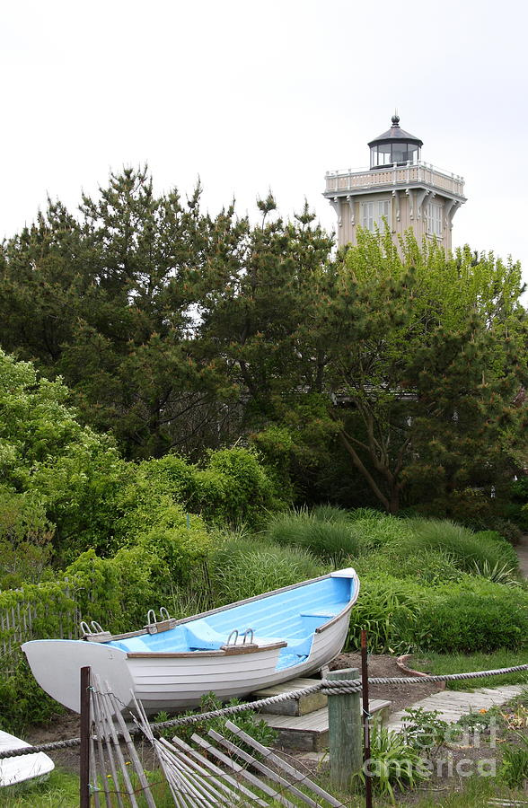 Hereford Inlet Light And Boat Photograph by Christiane Schulze Art And Photography