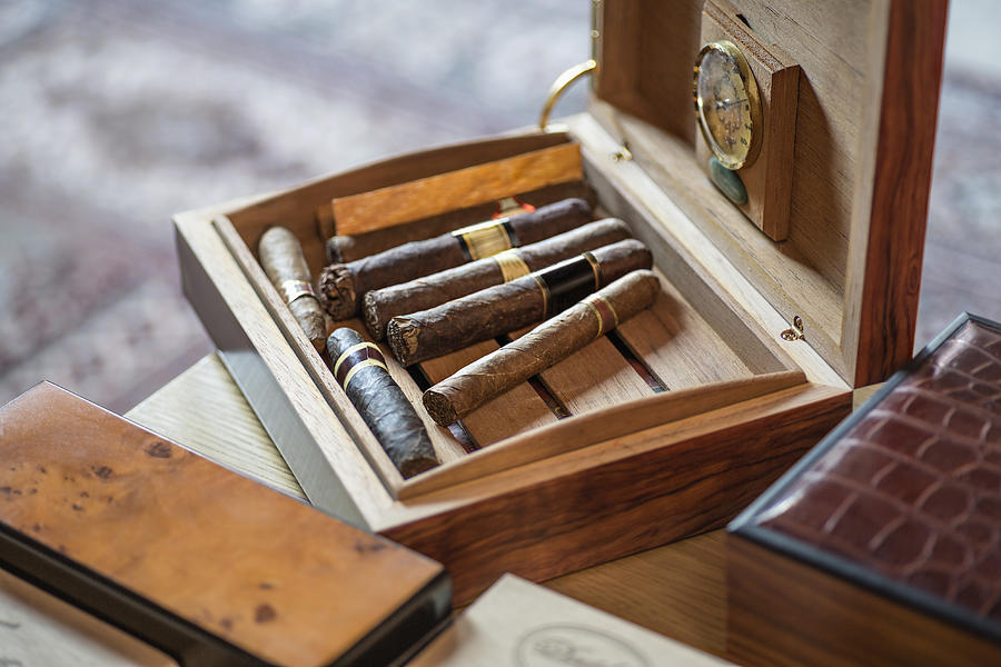 High angle view of cigars in wooden box on table Photograph by Vladimir Godnik