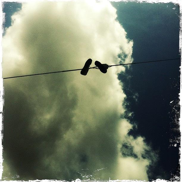 Up Movie Photograph - High Jump #shoes #wires #up #clouds by Sharon Wilkinson