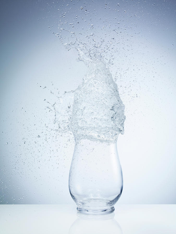 High Speed Image Of Water Exploding On Photograph by Level1studio
