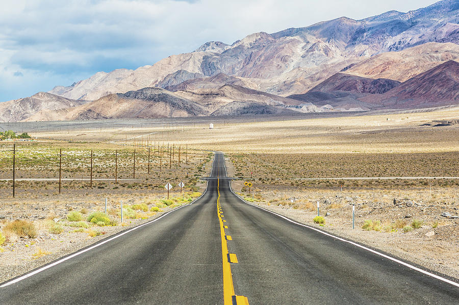 Highway Through The Desert Region Of Photograph by Deimagine