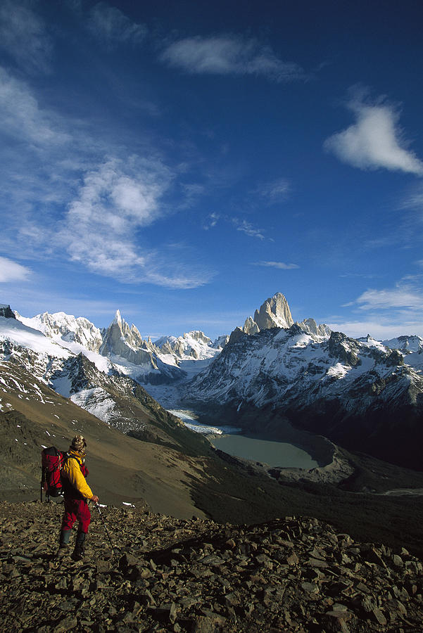 Hiker Admiring Cerro Torre And Fitzroy Photograph by Colin Monteath
