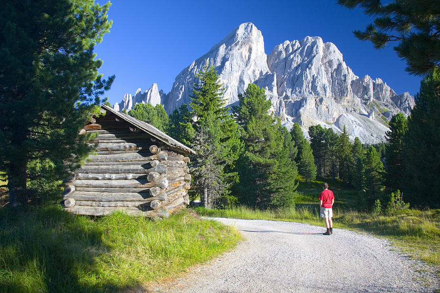 Hiker at Passo delle Erbe, between the Val di Funes and Val Badia, looking at peak of Sas de Putia in the Parco Naturale Puez-Odle, Dolomites. Photograph by David C Tomlinson