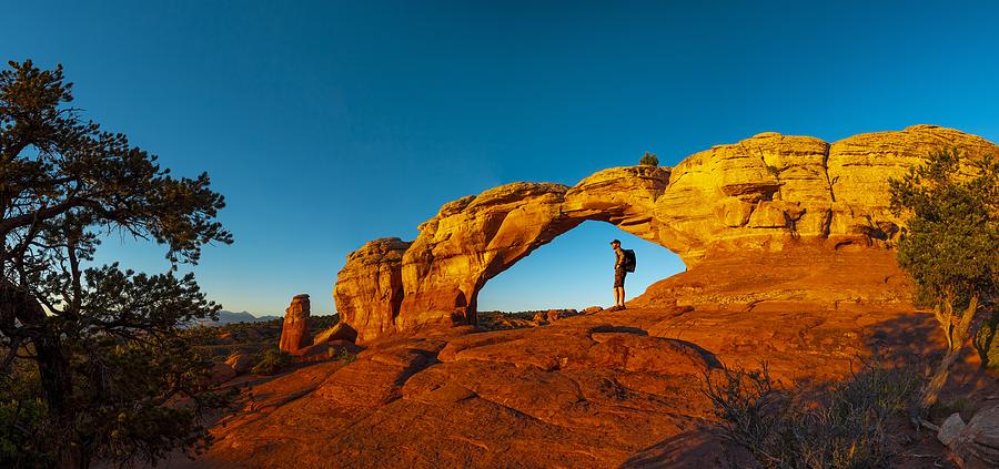 Hiker resting in Turret Arch Photograph by Sproetniek