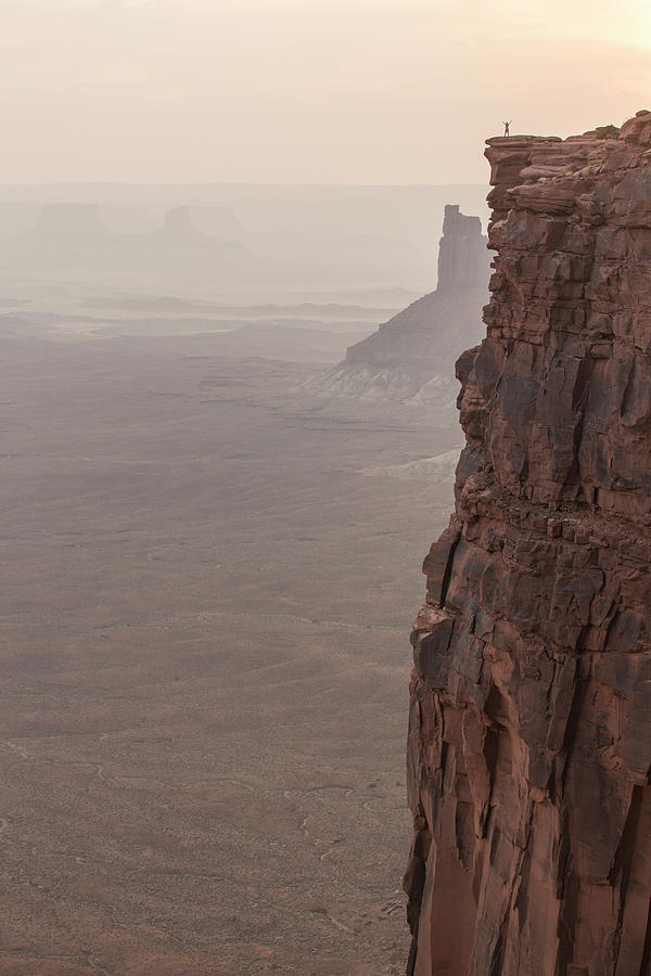 Canyonlands National Park Photograph - Hiker Standing At Sharp Cliff Edge by Matt Andrew