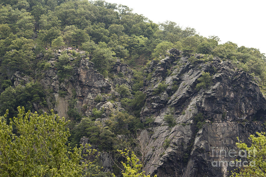 Hikers on the Maryland Heights overlook over Harpers Ferry WV Photograph by William Kuta