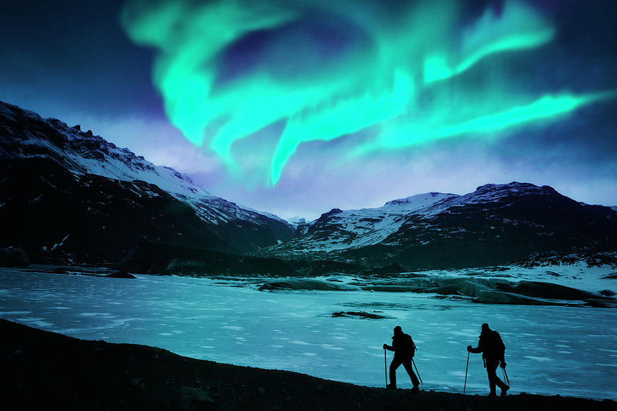 Hikers Under The Northern Lights Photograph by Powerofforever