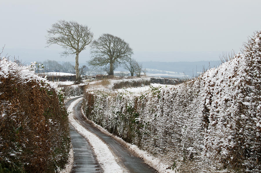 Hill top lane in snow Photograph by Pete Hemington