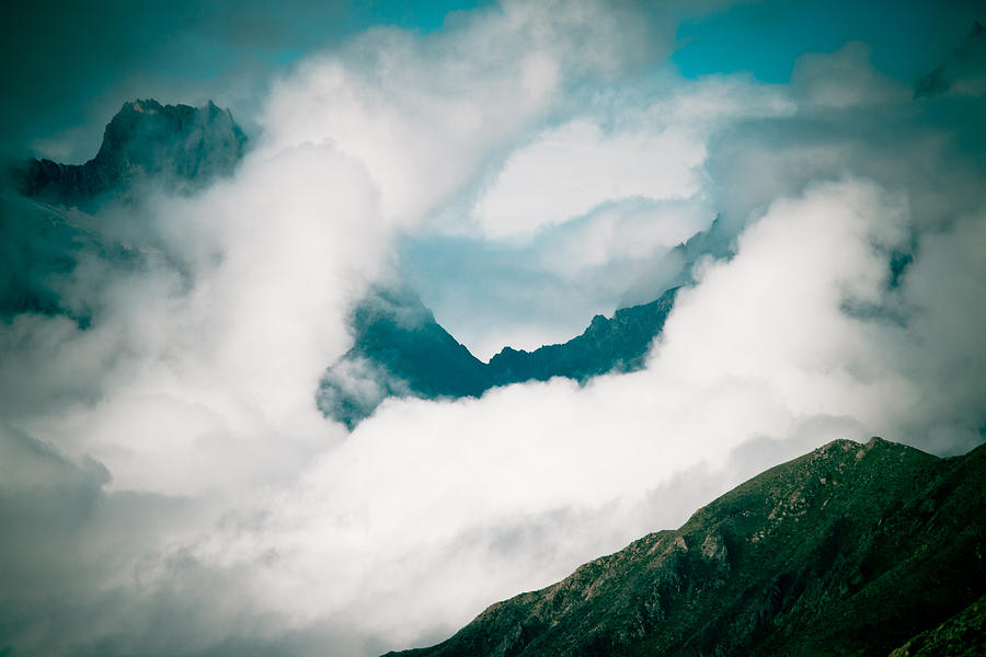 Himalyas range in clouds at Tibet Photograph by Raimond Klavins