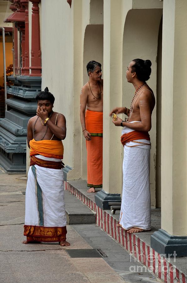Hindu priests relax after morning rituals Singapore Photograph by Imran Ahmed